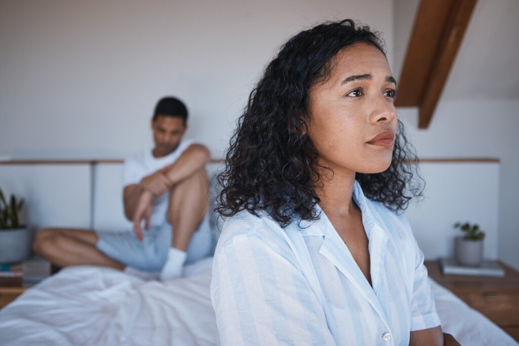 couple fighting in bed