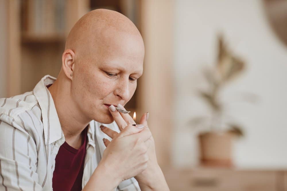 Bald Woman Smoking Marijuana Joint