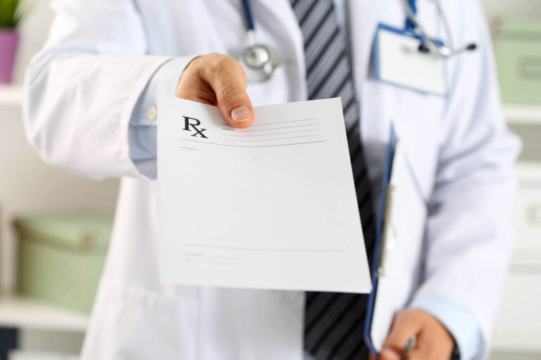 a doctor holding a prescription