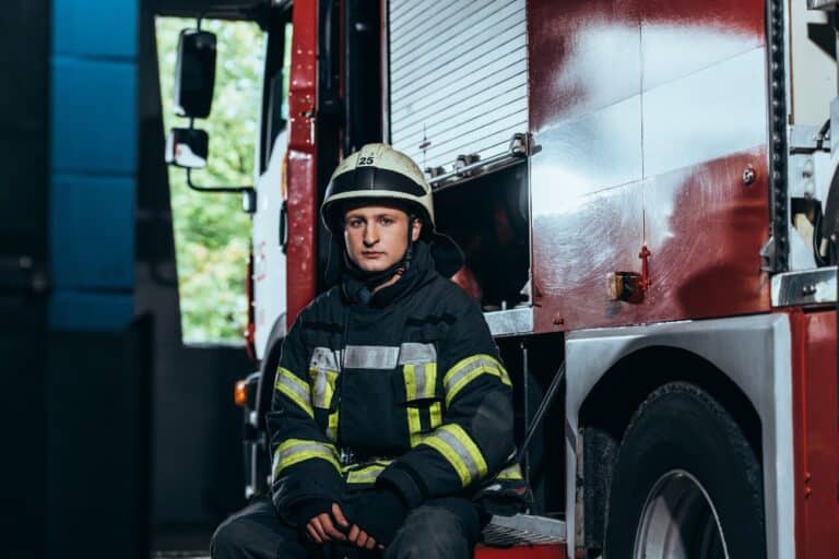 firefighter in uniform and helmet