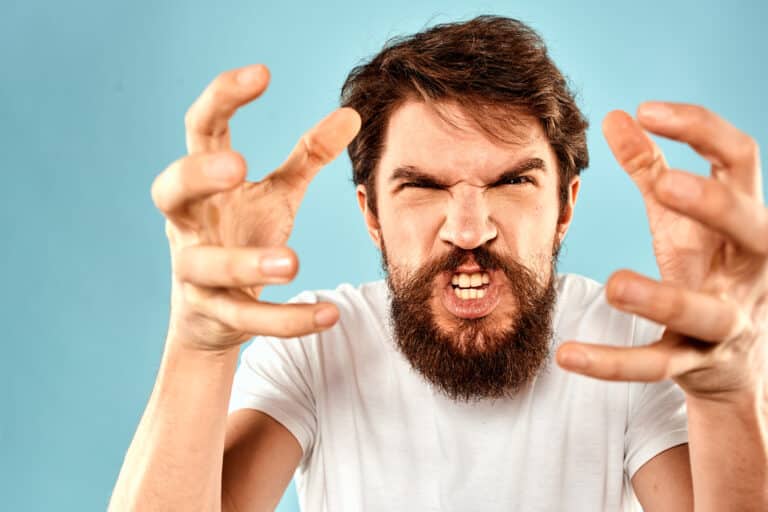 Bearded man emotions facial expression gestures hands close-up blue background. Conduct Disorder