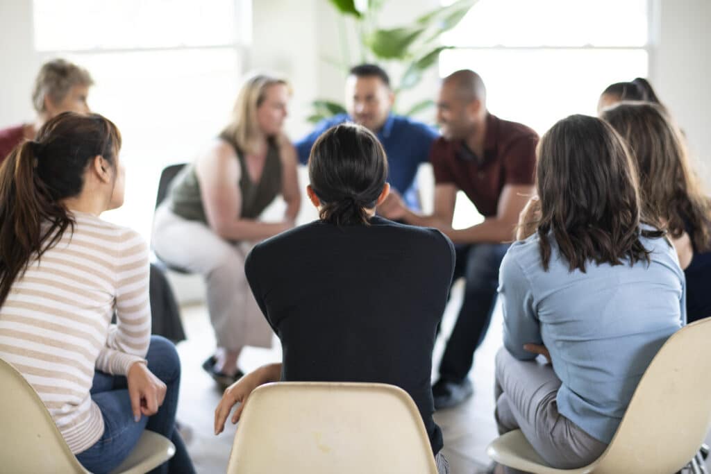 Diverse people in a supporting group session for OCD and Narcissism