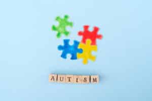 Autism spelled out with puzzle piece.